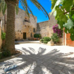 View of traditional and modern homes set in Gozo’s scenic island landscape
